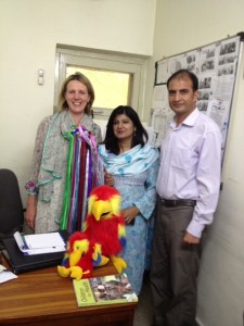 Clare Hanbury and colleagues in Pakistan planning collaboration ZZ and the rainbow stick helping!