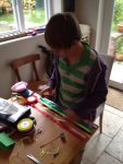 Clare-Hanburys-son-Danile-helping-to-prepare-a-demo-version-of-the-CfH-rainbow-stick-for-an-event