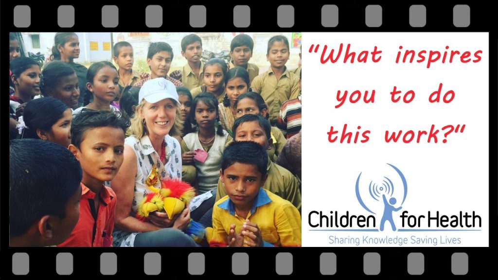 Photo of Clare Hanbury with a group of children, on the right it reads, 'What inspires you to do this work?'