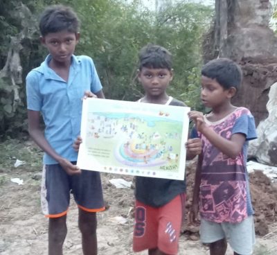 Three children hold a copy of our Children for Health Vision poster.